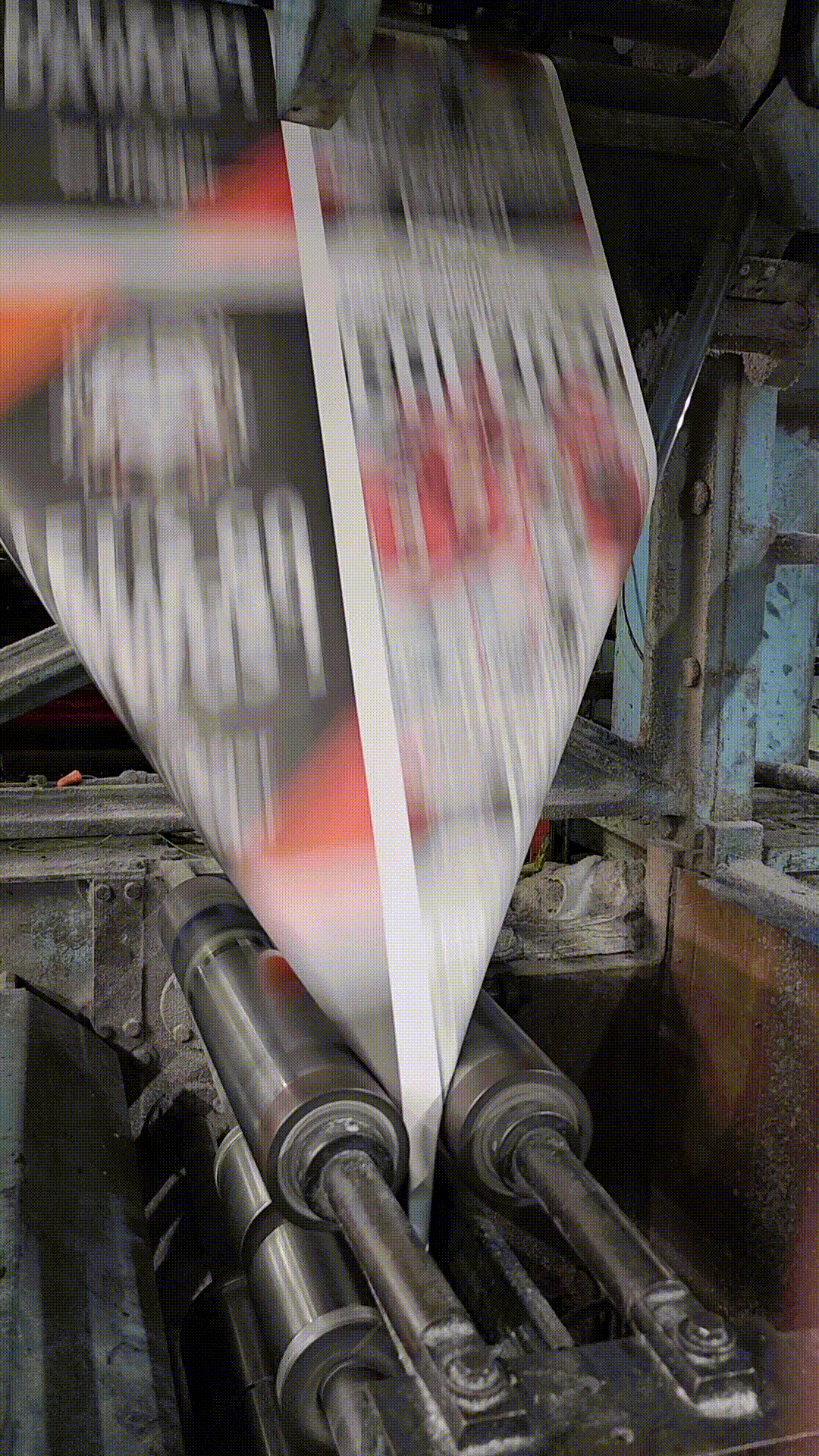 Special editions of The Atlanta Journal-Constitution with the headline "CHEERS!" are folded in a newspaper press in Gainesville, Georgia.
